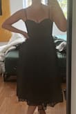 The dress quality is okay. Overall, it's cute but I'll be returning, as I find it's not flattering for my hourglass shape. It feels too puffy. The bust cups were also a bit too small. I'm sure it fits cute on other body types! - Maryse F.