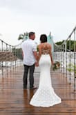 This dress was perfect! It fit in all the right areas and was very comfortable to wear. I got a size small and am 5'4. I didn't wear shoes so it was a little long but was still perfect! It unfortunately rained on us during the ceremony, but I wouldn't have changed a thing! - Amy B.