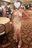 I LOVE this dress and am so glad I bought it for my wedding afterparty!! The material is gorgeous, and the dress itself is so soft and comfortable. The arms are unrestricted so I was able to dance pretty freely. So many people complimented me and said they loved the dress; they said I looked like Marilyn Monroe! I debated getting a small, but the medium ended up fitting perfectly, it was looser around the waist but was a more forgiving fit that way. I had to get it hemmed but otherwise, no alterations were needed. Good quality for the price, and the dress was as advertised (matched pictures online). I'm a bigger gal but I still felt very sexy in this. - Neil I.