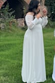 I bought this dress for a family photo shoot, and I do not regret it. I loved that it is off the shoulders with sheer sleeves. It also has a cute slit on the side that makes it even better. I ordered a size L, and it fit a bit snug but I didn't mind it because it wasn't too tight. Definitely recommend! <3 - Aurora E.