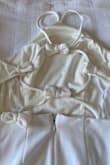 It fits nicely and beautiful, but I received a dress with a missing bow. It's supposed to have 6 bows, and mine only had 5.  So disappointed - Monette R.