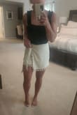 I love this bodysuit! It is of great quality, runs true to size, and is very comfortable and flattering. I paired it with a khaki tasseled scorch from Lulu's picture below! Loved the whole outfit. - Tara F.