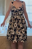 I really wanted to like this dress. I wasn't crazy about the flower pattern and thought the belt looked cheap, but it looked good on the model so I bought a size medium. (The alternate pattern/color to choose from was a solid orange, and I didn't find that color to be particularly flattering. The limited color choices were disappointing to begin with). The description said "Bust: Great for any cup size." I respectfully disagree. This was not flattering on my bust size. You could see that the size of my bust didn't fit the cup size and went below that horizontal stitching line, which doesn't look flattering when your bust is too big to even fit within the allocated cup area. I'm 4'10'' and 115 lbs, and my cup size is probably a 34DDD. I even put a minimizer bra on and still felt that my bust looked way too big to be flattering with this dress. I didn't find the dress's cup size to be "great" as advertised. This dress makes me look short and stout instead of tall and lengthy. Overall disappointed :( - Rachel K.
