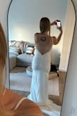 Ordered two dresses, and ended up finding the one! This wasn't it. The back just wasn't as flattering as I had hoped. Maybe if I was taller, just didn't seem to hit the right spots. Material was great and it felt much more expensive than it was! Would be great for a beach wedding! - Taylor N.