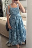 This dress is SO pretty! I followed the reviews and ordered a L thinking it was going to run small, and it was way too big for me. I returned it and got a M, and it fits perfectly! Perfect for my nephew's baptism! - Oriana C.