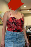 I could probably size down. There is no stretch in the top part but it's super cute with shorts, pants, or under a blazer. - Aylin T.