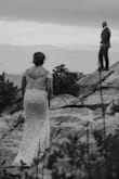 I wore this dress (size 6) to my mountain top elopement. I have a muscular build, so it was on the tighter side, especially in my hips and arms. Still, I hiked up a mountain for about an hour in this! The sleeves don't have a lot of give, so I would just move them up onto my shoulders as needed. There is not much of a train on the gown, which was what I wanted. I had the dress hemmed and added a button for a bustle. It was secure enough that I didn't need to wear a bra.
This is a PERFECT dress if you want something beautiful that's inexpensive. Just make sure you get the right fit and you'll love it. > - Rose H.