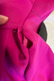 I ordered this dress and it fit like a glove; unfortunately upon inspecting the ruching that didn't look right, I saw there was a big hole on the left hip of the dress. I just paid extra for shipping to get this dress in a bigger size and hopefully it'll fit (and arrive in time) but I am extremely disappointed. Also I don't think we should have to pay for a stocking fee for damaged clothing. - Nelly M.