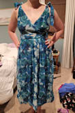 This looks nothing like the dress advertised! I was hoping to wear this for a black tie wedding this weekend, but I received a tea length dress with no purple flowers instead. Very disappointing! - Laura S.