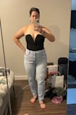 I ordered this body suit in an xl, and I wasn't sure if that would be too big or too small. Lulus tends to run a little big sometimes. I believe I am a true xl in most items: top or bottoms. I got this in xl and it fits perfectly! If I sized down it would be too tight or short on the torso. I love how it can be dressy or casual! The V does kind of stick out at the bottom but it's not a dealbreaker. Def will get some fashion tape so I don't accidentally give a free show! - Adrienne S.