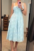 I absolutely love this dress! I like being able to adjust the waist to make it tighter or looser, depending on how I'm feeling. I'm a size 6, typically a size medium, and I'd say it runs true to size, if maybe *slightly* small. If you're in between sizes, I'd size up on this one. Can't wait to wear it! - Laura M.