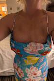 This dress is so cute. My only issue is the top doesn't want to lay nicely on my breasts. I even tried tape to hold in place. Just doesn't look right.
The photo includes the look with 2 sided tape. - Judy D.