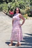This dress is absolutely beautiful, just as pictured colors are soft and elegant. I bought this for a wedding, however could not zip when I got to the rib cage. Was big in the chest area so sizing up would've made it droopy. Fit in the waist and the hips perfectly, just small and tight in the rib cage. I ended up letting the zipper out so it was not hidden and it showed, but it was under the arm, so it did not matter. It gave me a half inch that I needed. - Sharlyn S.