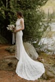 This dress was everything I dreamed up for my mountaintop and lakefront elopement! I had the straps and button closure taken in slightly for a better fit and loosely attached the slip to the lace on the bottom so it wouldn't pop out and show too much, but other than that everything was perfect! It's very flattering, super comfy, and I received so many compliments from people! It was definitely worth the cost! It also held up well to hiking down a mountain and walking through a forest. I can't recommend this dress enough! - Julia B.