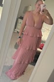 Loved this dress so much! Having the ties in the back helped keep everything secured. It was very long on me so I had to get it hemmed. I am 5'3. I received so many compliments! Both pictures are unfiltered. It is definitely more pink in the sunlight! Super flattering! - Hayley B.