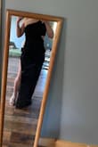 I LOVE this dress. The cut out gives it such a nice touch! The heels in the picture aren't the ones I'm wearing to the wedding; I did get a pair a little taller! I'm short, and the dress hits perfectly in all the right places! I also have a smaller chest and I don't have to wear a bra or sticky covers with it! - Makenzi F.