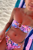 I wore this bikini for my trip out to Miami, and it was perfect! Usually, I'm skeptical about getting bandeau because I have a small bust and they have a hard time holding the bandeau in place. But, this top held in place while tanning, walking around the city, and taking a dip in the ocean. Overall, the bandeau was great. I loved the bright colors, the fit, and that there was padding. I had to adjust the top here and there, but that's life with a bandeau. Great bikini and had to get it with the matching bottom to match. - Michelle K.