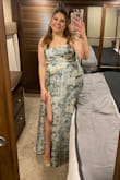 I wore this dress as a bridesmaid at my sister's wedding, and I thought it was fabulous! I loved it and felt comfortable all night long! I was able to dance in it and the slit made it sexy and breathable! The top layer of fabric is like a reflective sheer fabric but it looked really nice and cool. It came out great in photos! It was backless, but the fabric in front is thick enough that you don't have to wear a bra if you don't want to. - Madie S.