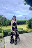 I purchased this dress for a wedding in Hawaii. I ordered a small and a medium but ultimately kept the small because the print in the medium, which fit better, had a flower somewhere I didn't like. The small would not zip up all the way, so I had the dress tailored to let it out. I also had it altered to be taken up (it's super long); the neckline closed slightly and cups added in. The dress was definitely perfect for the venue, and I loved wearing it! - Morgan M.