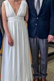 I originally ordered this dress in Large but I exchanged it for the Medium and it fit like a glove! I'm 5'10 and 160 lbs and wore this for my courthouse wedding. This is a great dress for us tall ladies. It is so elegant and simple, which is exactly what I was looking for. - Viktoria C.