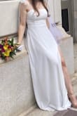 I got this dress as a last minute wedding dress and it came thru. I did the fastest shipping and surprisingly came the next day. The dress itself is pretty. It's thick layers/quality. It was a bit long for me (I'm 5'4) even with 3 inch heels it was slightly touching the floor. Because it's folded during shipping it does need some ironing before wear, and I let the bows hang for a while to let them not be so stiff. Overall I'd give the dress a 7.5/10. It's good for its price, would've gotten higher score if they had a smaller size available to me (xxs). - Sara F.