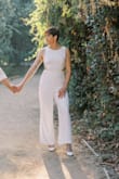 I bought this jumpsuit for my engagement photo session, and it was fantastic. It fit me in all the right places and looks incredible in the photographs. I can't wait to wear it again for my rehearsal and rehearsal dinner. - Jenifer S.