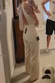 I absolutely love this! The back detail is a showstopper. I'm wearing this to a wedding in which the couple has asked their guests to wear specific colors and champagne is one of them. I love that it's elegant but comfy enough to dance in! I'm 5'9, 140 lbs, 34D, 27 waist. I teeter between a small and medium in Lulus clothes, and the Medium is perfect. I am tall and can even wear heels! The chest is a tad big (I am pear-shaped, so large on the bottom), but nothing that double sides tape won't solve! Can't wait to wear it next month! - Page D.