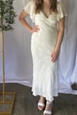 This dress was perfect for my bridal shower. I love the material, and it fits really nice. I was concerned about the top part because of the reviews but with the right strapless bra, it was comfortable to wear for the whole day! - Aubrey F.