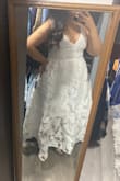 This was a gorgeous dress, however, not for me. I'm very short so it was too long, and I think it made me look a little bit bigger than I am because of the overskirt. It was super comfortable, and the corset back lets you adjust it perfectly, so it fits just how you want it to. I ended up returning it (mainly cause of the length) but almost kept it cause it was so pretty; might order it again if I change my mind in the future. - Mariel R.