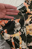 Had literally just taken the dress out of the package to try it on and saw the underwire poking through the front of the dress. I was able to weave it back in, but then the other half of the wire was just free-floating? Didn't waste my time seeing if it fit or was true to size (disregard the rating above for size as it was required) before preparing it to return. - Michele K.