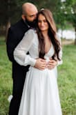 Wore this for my elopement and it was beautiful! Very light and breathable. It was pretty low cut in the chest on me, but it still looked amazing! - Kailee G.