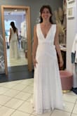 This is the dress I chose for my wedding! It was indeed larger on top so I got an XS. The size down is a tad snug in the waist, and I still had to get the top fitted. I'm wearing a deep cut bra that i got on amazon to get the boob pop that is on the model photo. Overall I'm really happy with how it turned out. The seamstress also added a clip to hang the train (does not come with the dress). Perfect for my simple forest wedding. - Kristina C.
