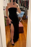 Fits beautifully- it's snug but that makes it so the dress isn't going anywhere and I'm not worried about having to pull it up all night. There's a rubbery no-slip piece along the top of the dress as well. The slit makes it breathable which is perfect for a summer black tie wedding. I also have wide hips but a smaller waist/torso and typically struggle with dresses, but this one is stretchy and hugs my curves. 

One of the flaps on the back from where the top folds over doesn't lay flat (probably because it's slightly tight) but it's an easy fix with some fashion tape. - Abbey M.