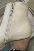 I'm normally a 7.5, but these are very tight around the ankle with not much give. The zipper feels cheap. They fit true to size 7.5 otherwise. The material they're made of is also very flimsy looking. I'll probably just wear these for my wedding and then sell them. - Shelbi S.