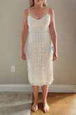 This dress is beautiful, true to size, and good quality. My pet peeve is when dresses that are supposed to have symmetrical beading are off-centered, and this one is perfectly symmetrical. I would love it if it stretched just slightly because it is a tad big in the hip, and you can see it when it's on. - Carly B.