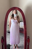 I bought the jacquard pleated satin midi dress in lavender for a wedding, and it was perfect! The flowy design was incredibly flattering and comfortable. The lavender color and jacquard pattern added a touch of elegance. I received numerous compliments and felt beautiful all day. Highly recommend for special occasions! - Jennifer C.