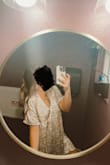 This dress was very pretty! I got lots of compliments on it. The cut is very very very low and would show lots of cleavage (I don't have any to show hahaha) It is also very short. I am shorter so it was a perfect length for me. I ordered a size xs, and it worked great. It was still pretty loose. I am normally a size small. - Samantha J.