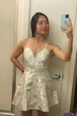I bought this for a casual look on my post wedding brunch event. I like the shape of the dress and how lightweight it was, but didn't keep it because 1. the fabric looked "rigid" when moving around and had a weird reflection to light, 2. the fit at the waist was very loose unlike what's shown on the model (I think it's because the sizing runs a little large) - Aurelie W.