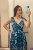 I bought this dress to wear at a floral-themed wedding and was disappointed with the fit of the dress. I loved the pattern on the dress, very beautiful and quite original! I normally dress in an S size but bought an M size, as it was out-of-stock in my normal size: I expected it to be too big, and it was, so it is true to size IMO. Besides my self-inflicted size issue, I found that it had a weird fit. As a small chested person, I felt that the criss cross created a lot of volume under the chest around the stomach area, but the criss cross would reveal my underboob line if I had a bigger chest, so I would say it is unflattering for most body types. The dress is also voluminous under the waist belt, so the dress made me look bigger than I am. Lastly - not a problem for me, but you can't wear a bra under this dress. - Aurelie W.