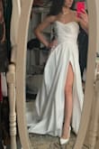 The dress was perfect especially for the price. Similar dresses I. Bridal shops were at least 4x the price. I did have to get it shortened and the bust was too big even for the XS. Once tailored it was a perfect fit. Very happy with my decision to go with this dress zero regrets.

When getting a veil I thought the dress would be a brighter white but it actually is a warmer weight so I recommend going with an ivory veil. 

Photos I post will be of the dress before and after getting it altered to see how the dress originally fit. - Petra M.
