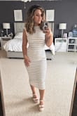 Obsessed with this dress! I got so many compliments on it while I was out on date night with my husband. It fits perfectly, with a lovely amount of stretch to it. - Helen D.