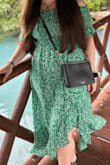 I ordered this in a small even though I am normally a medium because of the stretchy top. I think it may have been more flattering a little smaller in the [bust], but I needed the room in the arms. Overall, it was flowy, comfortable, and super cute. - Victoria S.