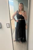 This black, studded belt is absolutely adorable! It comes in one size and if you're typically a size large or bigger, it's a little on the small side. If you're hoping to wear it for pants that are low-waisted, it's probably not going to work for you but if you want to wear it for high-waisted pants or to create a more cinched waist on a dress, it works great. I definitely was using the last hole on the belt though. It definitely completed this outfit ensemble for me! - Katie G.