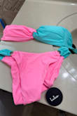 I love the bikini neon color, but the bikini top doesn't stay in place; it won't maintain the shape. - Melkys H.