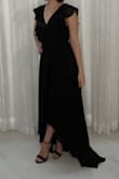 This dress runs large and is pretty long. I think an XXS or smaller would have fit better, but the smallest size is XS. I didn't mind the length since it was in the back, and it was for an indoor wedding, however, I would say it's not made for the petite. I would also recommend putting double-sided tape for the chest area to ensure it stays closed. Other than that, it was very comfortable and really cute! - Jessi L.
