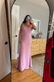 Beautiful dress with a thicker material. Straps are adjustable for length. I did have to get the dress hemmed because it was too long (I'm 5'2") and now it is perfect. The pictures show the dress hemmed and before when it was long for reference. - Nicole M.