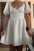 I bought this dress because I love the sleeves and think it is adorable! I wanted to wear this to my graduation, but it is a bit short on me, and I can't really sit in it without it hiking up really high. The fit is perfect, I just wish it were a little longer. - Bianca P.