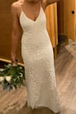 Everyone went crazy over my dress on my wedding day. It was conservative, form fitting, form fitting but not tight. The beading made it so I didn't have to worry about it wrinkling. - Molly R.