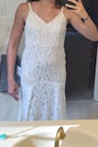 Very lightweight dress! I'm planning on wearing it for my honeymoon rather than my wedding. I couldn't zip it by myself so the top is a little loose. - Autumn P.