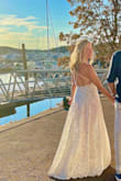 This dress was perfect for my beach elopement! I can't say enough good things! I was worried that I should have gotten a bigger size until my sister-in-law asked who altered it because it fit so perfectly! It's very forgiving and comfortable! With the built-in bodysuit, it keeps everything comfortably hidden but shows your body beautifully! It's even hand washable! I was able to get all dirt, shimmer, and makeup out of it. - Casey C.